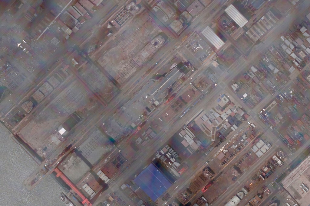 This satellite image provided by Planet Labs PBC shows construction of China's Type 003 aircraft carrier at the Jiangnan Shipyard northeast of Shanghai, China, Tuesday, May 31, 2022. 