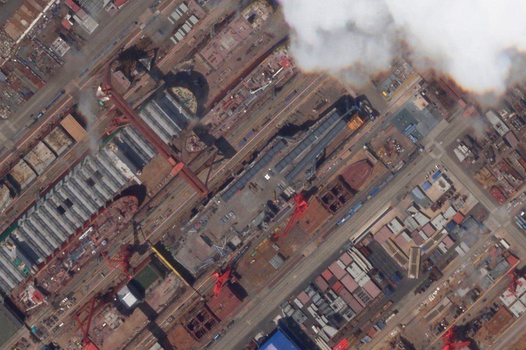 This satellite image from Planet Labs PBC shows construction of China's Type 003 aircraft carrier at the Jiangnan Shipyard northeast of Shanghai, China, May 21, 2022.  China’s most advanced aircraft carrier to date appears to be nearing completion, satellite photos analyzed by The Associated Press showed Friday, June 3, as experts suggested the vessel could be launched soon.