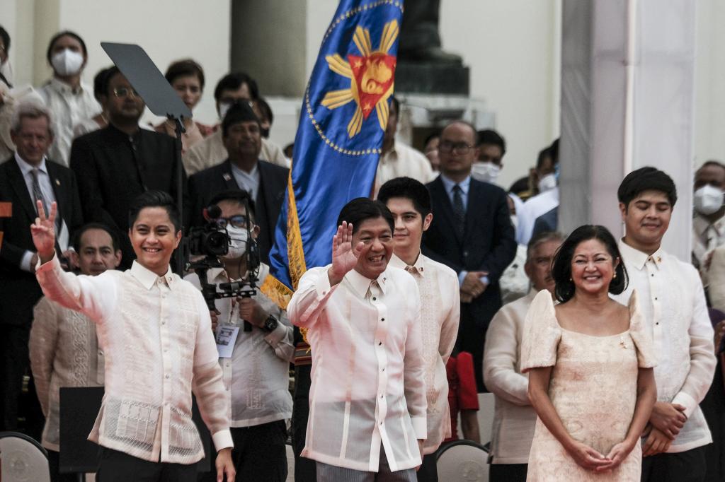 Ferdinand "BongBong" Marcos Jr., the Philippines' president, center, waves during the swearing-in ceremony at the Old Legislative Building in Manila, the Philippines, on Thursday, June 30, 2022.