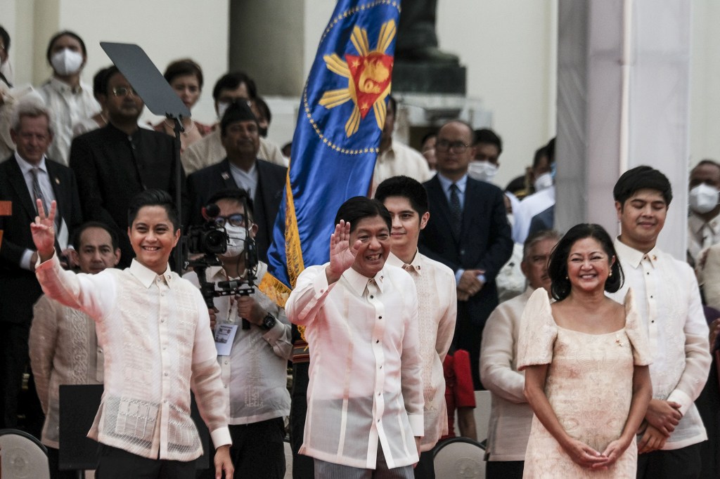 Ferdinand "BongBong" Marcos Jr., the Philippines' president, center, waves during the swearing-in ceremony at the Old Legislative Building in Manila, the Philippines, on Thursday, June 30, 2022. 