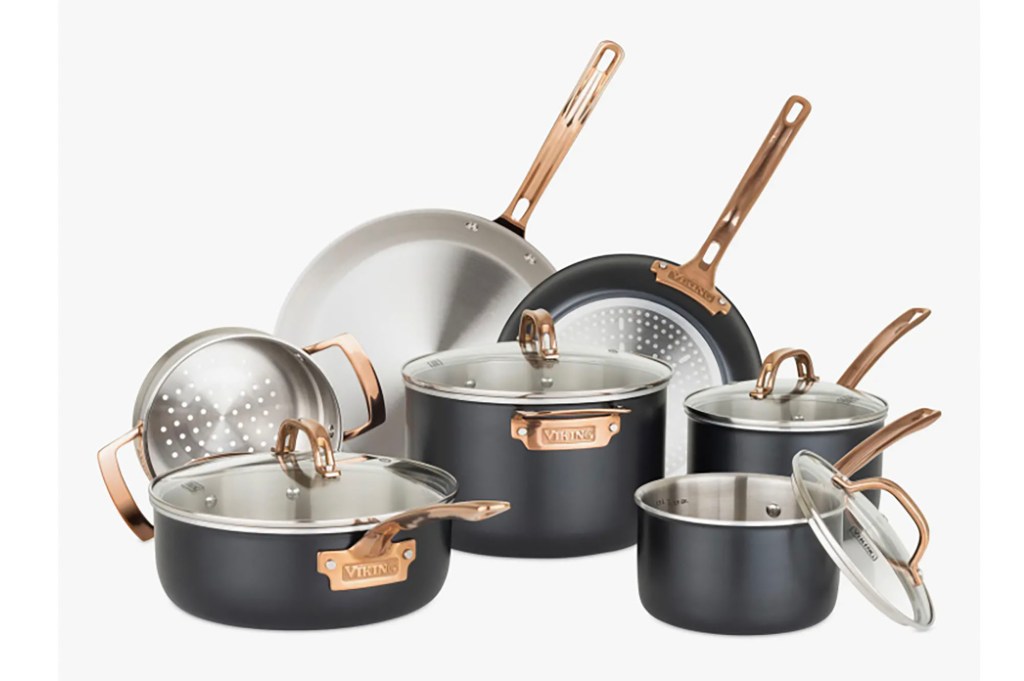 A set of black and silver pots and pans 