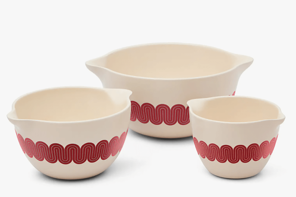 A set of white and red mixing bowls 