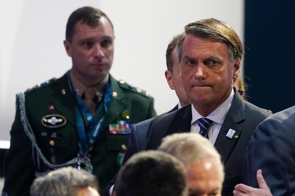 Brazil President Jair Bolsonaro, right, waits for the opening plenary session at the Summit of the Americas, Thursday, June 9, 2022, in Los Angeles.