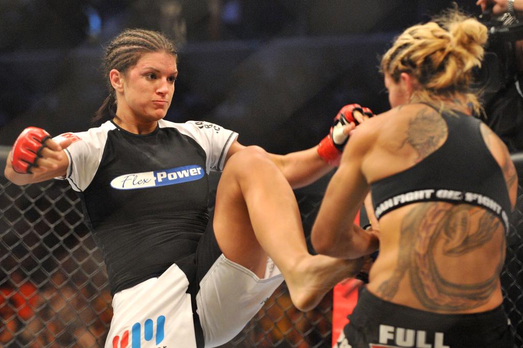 Gina Carano (right) fights fights Cris Cyborg in 2009 for the Strikeforce middleweight title