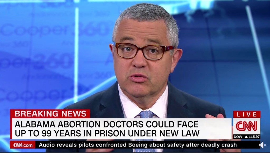 Jeffrey Toobin on CNN with a breaking news banner.