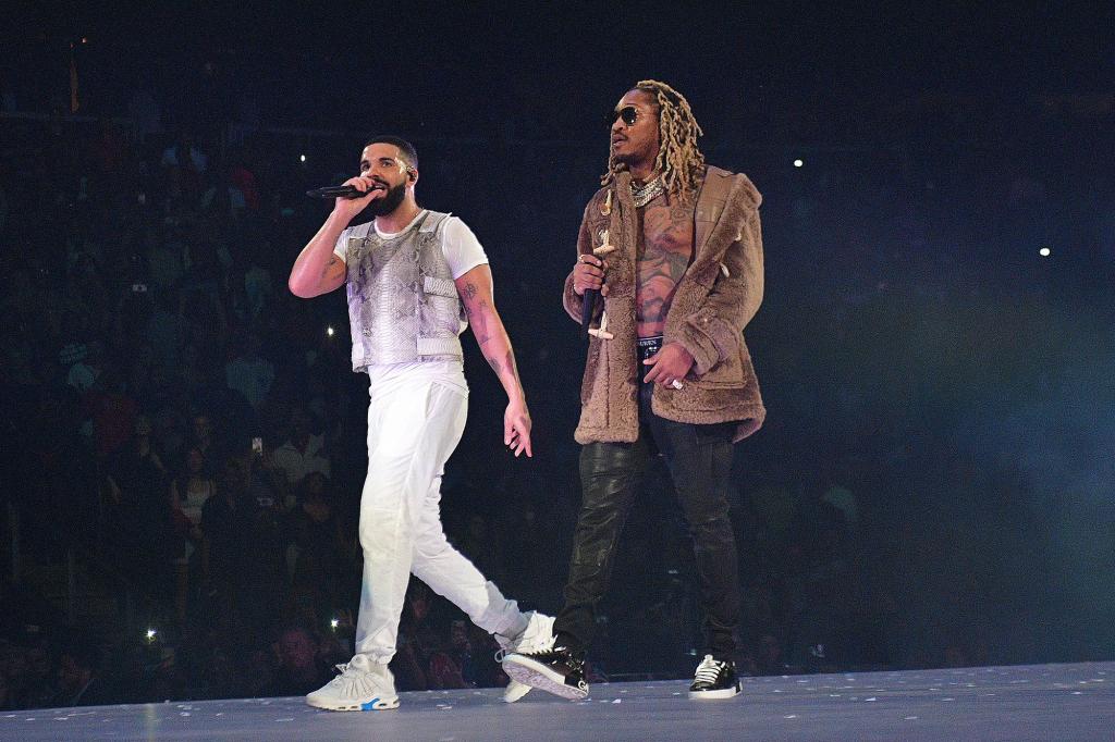 Drake and Future perform onstage.