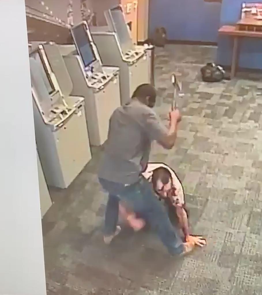 Surveillance video shows suspect Aaron Garcia attacking Miguel Solorzana with a hatchet in the ATM vestibule of a Chase bank on Broadway near Beaver Street in the Financial District, Sunday, Aug. 15, 2021.