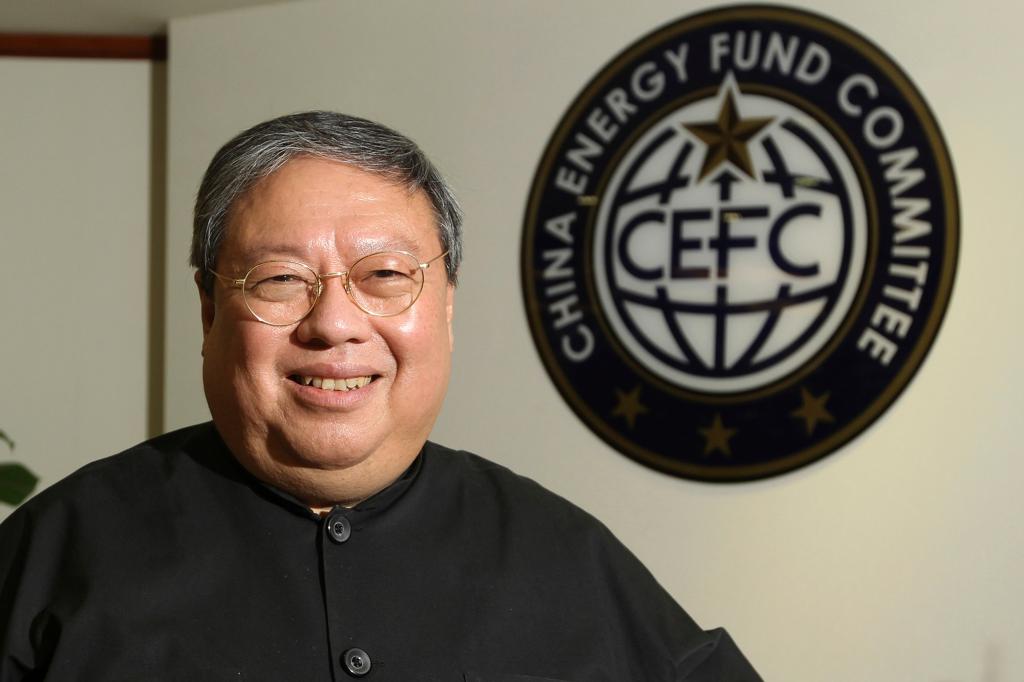 In this July 2015, file photo, Dr. Chi Ping Patrick Ho, former Hong Kong home secretary, deputy chairman of an non-governmental organization funded by CEFC China Energy poses during an interview in Hong Kong.