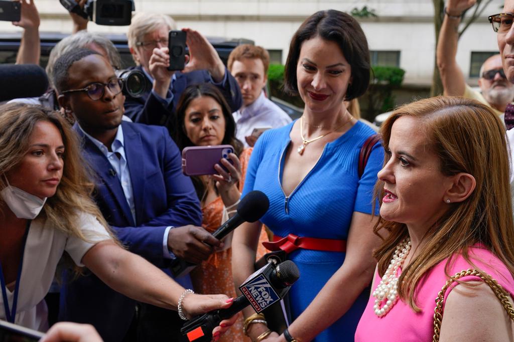 Sarah Ransome, second from right, and Elizabeth Stein, right, both alleged victims of Jeffrey Epstein and Ghislaine Maxwell, speak to reporters as they leave the federal courthouse in New York, Tuesday, June 28, 2022.