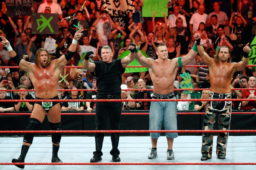 (From left to right) Triple H, Chairman Vince McMahon, John Cena and Shawn Michaels