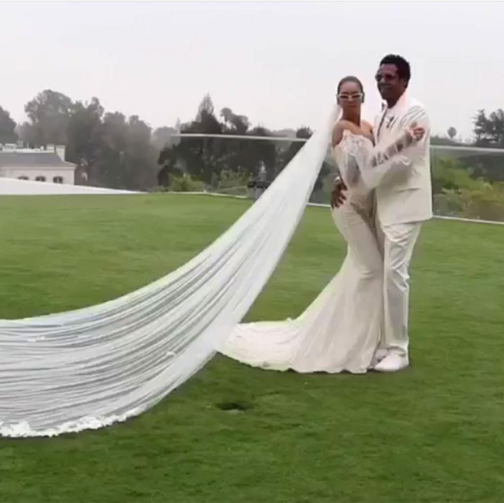 Jay Z and Beyoncé dressed in white at their vow renewal ceremony.