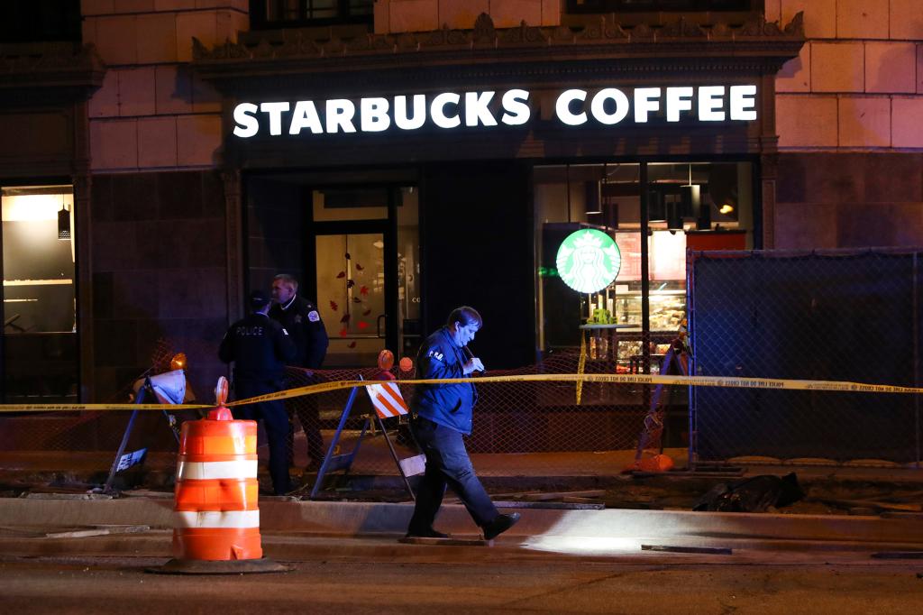 Police work the scene where at least three people were wounded in a shooting in Chicago.