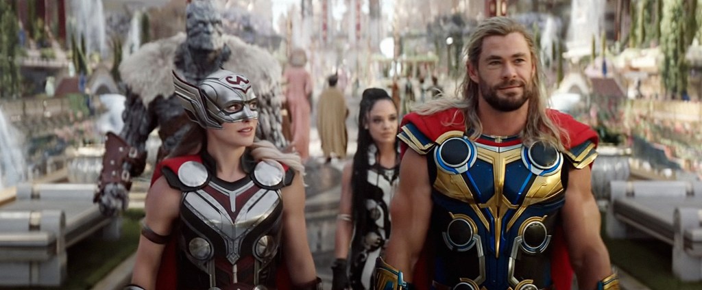 Natalie Portman as Mighty Thor walking alongside Chris Hemsworth as Thor