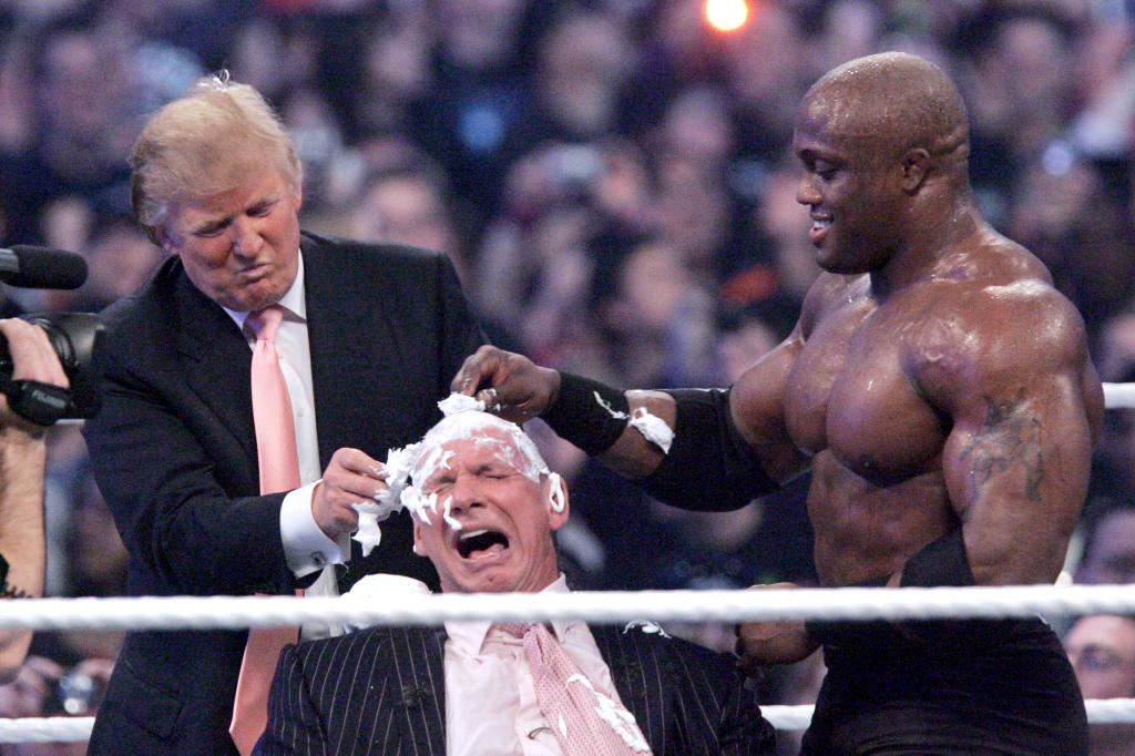 McMahon getting his head shaved by Donald Trump and Bobby Lashley in the ring in 2007.