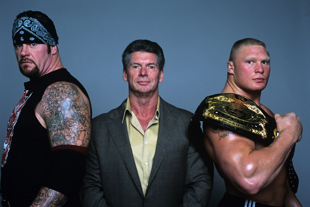 McMahon with WWE superstars The Undertaker and Brock Lesnar.