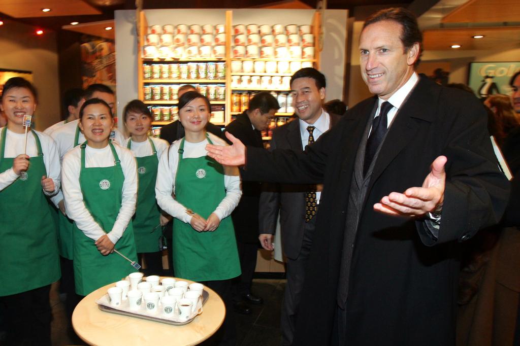 Howard Schultz, president of the US Starbucks coffee chain, delivers a speech to his employees in the first Starbucks store in Chongqing Municipality, China.