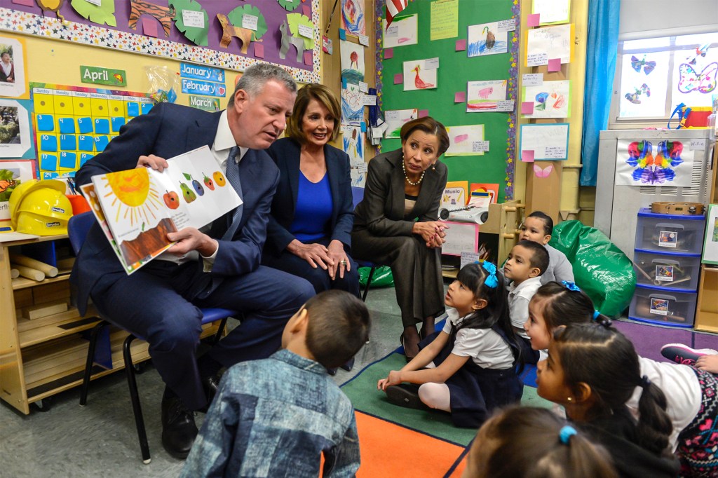 New York City Mayor Bill de Blasio, House Minority Leader Nancy Pelosi (D-CA) and Rep. Nydia Velazquez (D-NY) visit and read books to a Pre-K class inside P.S. 123 Suydam located at 100 Irving Avenue on April 6, 2016 in the Brooklyn borough of New York City. 