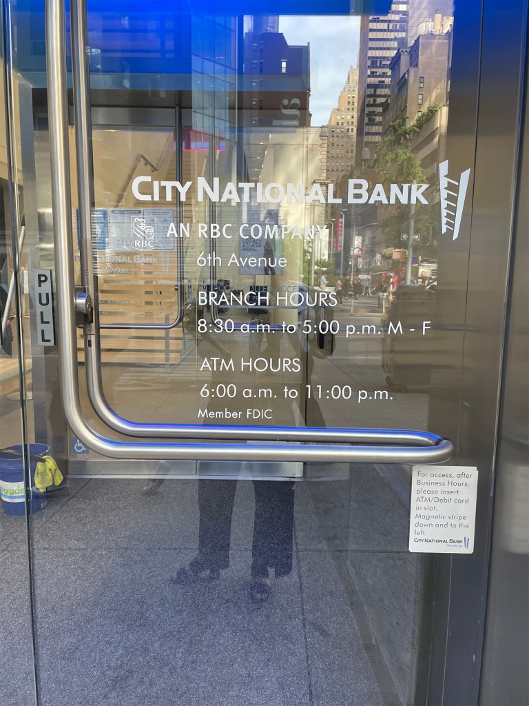 A City National Bank detailing its hours of operation.