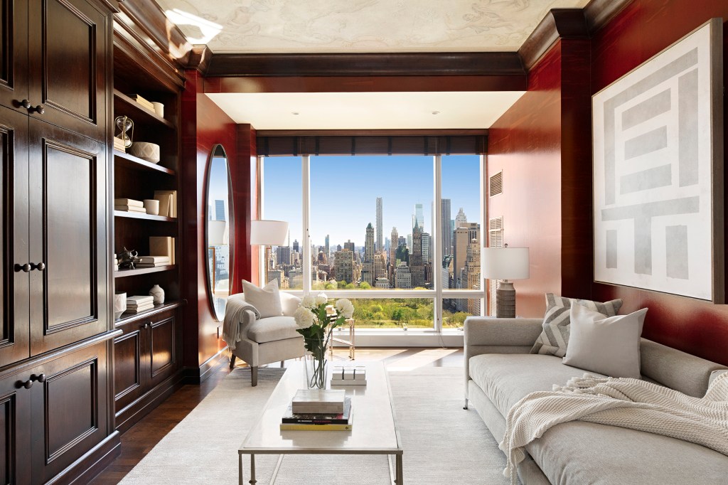 The home library has custom millwork.