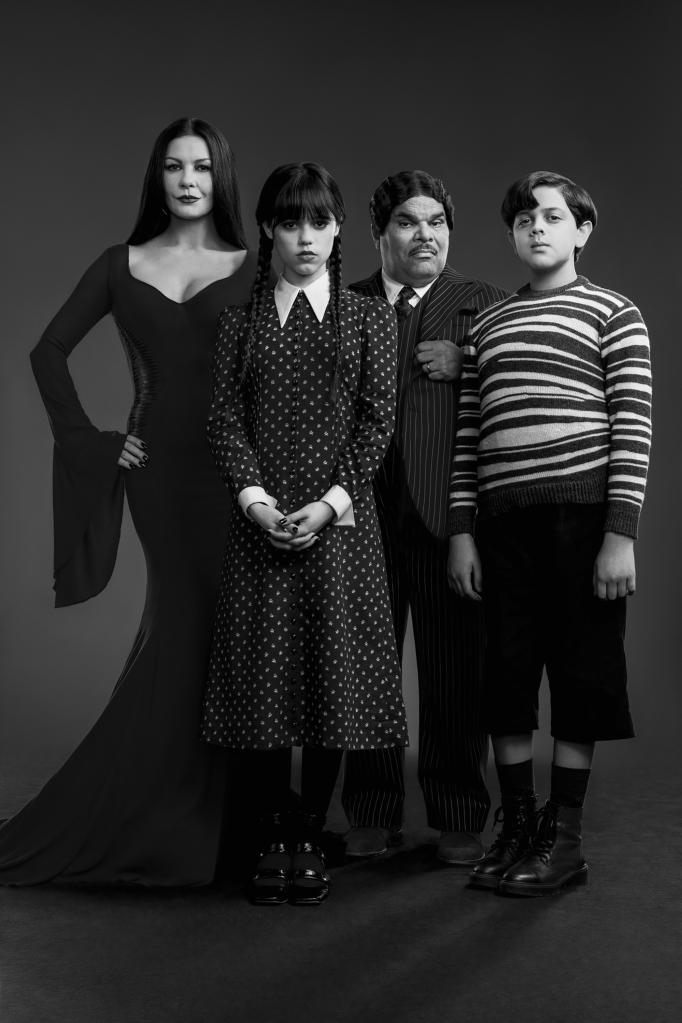 Wednesday. (L to R) Catherine Zeta-Jones as Morticia Adams, Jenna Ortega as Wednesday Addams, Luis Guzmán as Gomez Addams, Issac Ordonez as Pugsley Addams in Wednesday. Cr. Courtesy of Netflix © 2022