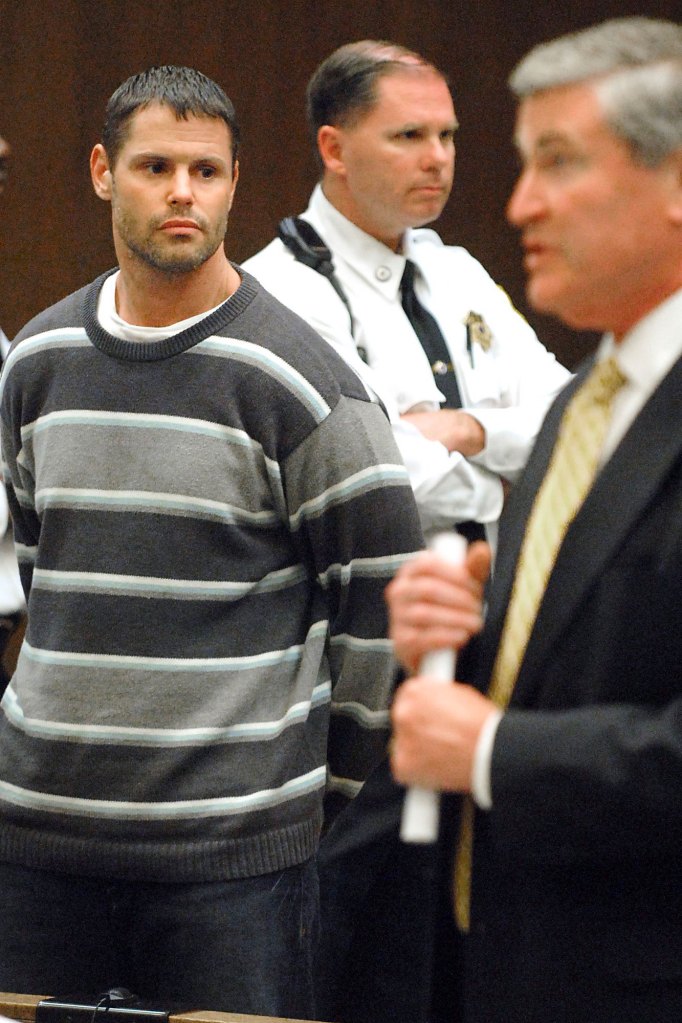 Fotios "Freddy" Geas, left, listens to his lawyer Michael Jennings, right, during his arraignment in Hampden District Court in 2007.