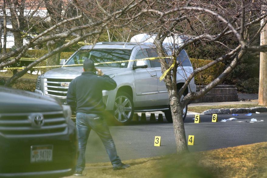 A picture of police at the scene of the crime where mafia boss Frank Cali was gunned down.