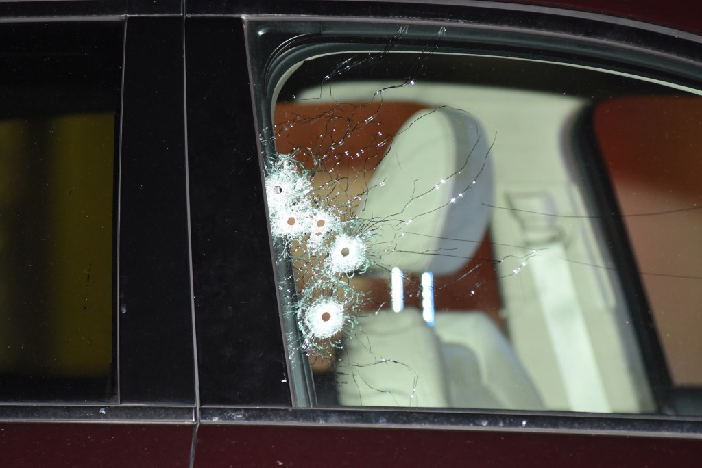 Zottola's car is riddled with bullet holes following the fatal shooting.