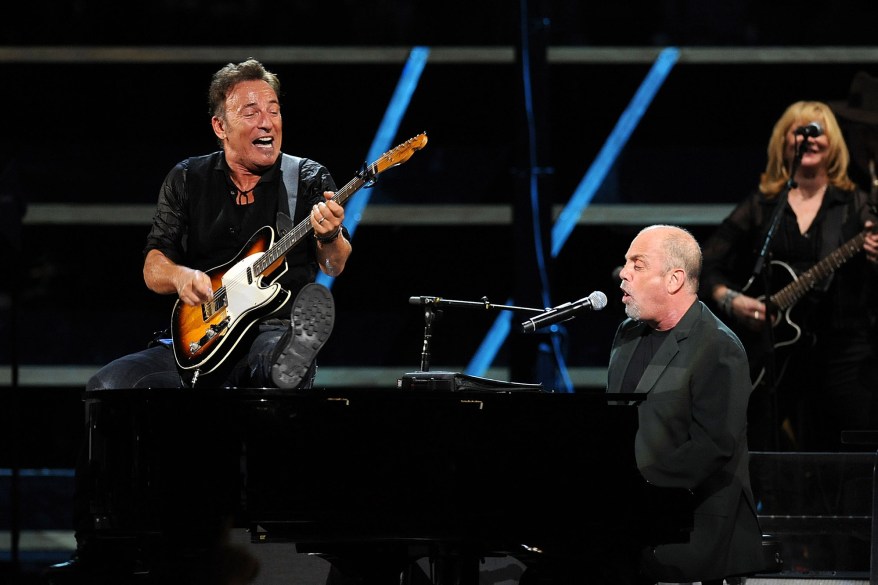 Bruce Springsteen and Billy Joel perform onstage at the 25th Anniversary Rock & Roll Hall of Fame Concert at Madison Square Garden on October 29, 2009 in New York City.