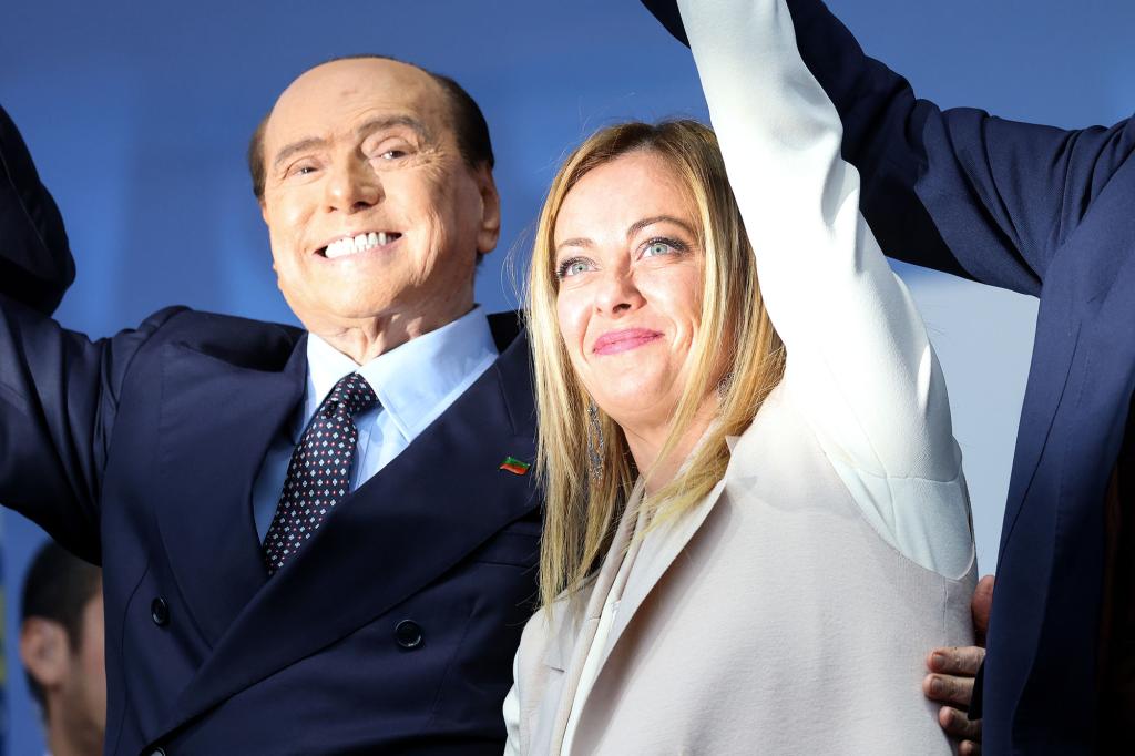 One of Meloni's coalition partners is Forza Italia led by ex-Premier Silvio Berlusconi, left.