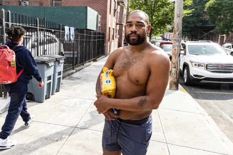 Michael Palacios, 31, who arrested after a viral video captured him wielding a hatchet during a fight inside a McDonald's in Manhattan's Lower East Side, talks to Reuven Fenton as he went to get dog food..