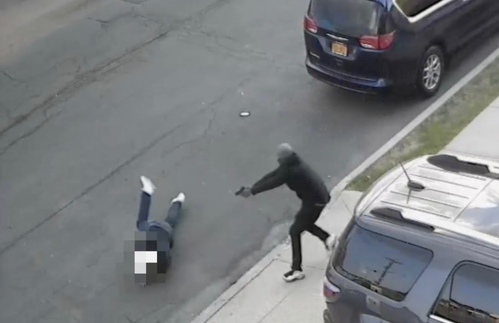 man shooting another man