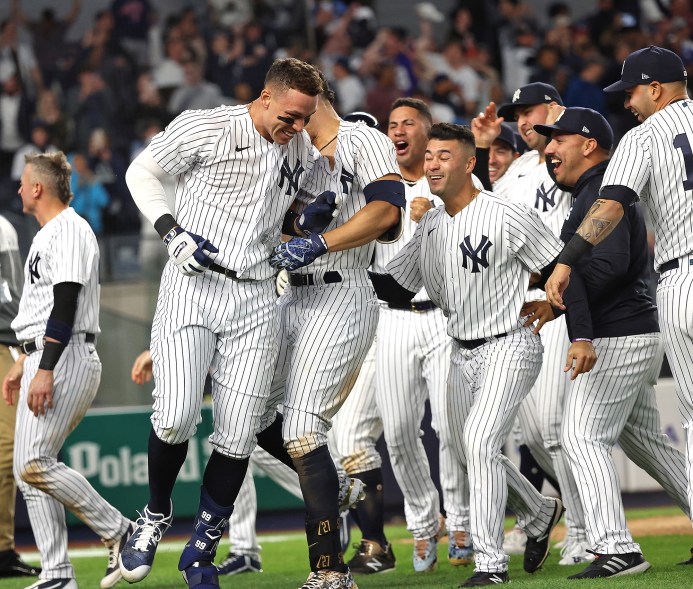 10 - Judge is mobbed at the plate after a walk off three-run home run to defeat the Toronto Blue Jays 6-5, May 10.