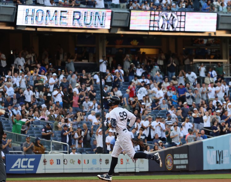 25 - New York Yankees center fielder Aaron Judge rounds the bases after hitting a solo homer in the 1st inning, June 25.