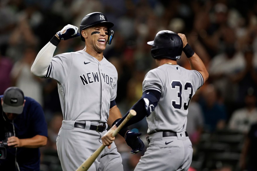 44 - Judge celebrates with Tim Locastro after hitting a solo home run on a pitch from Seattle Mariners' Ryan Borucki during the ninth inning Monday, Aug. 8.