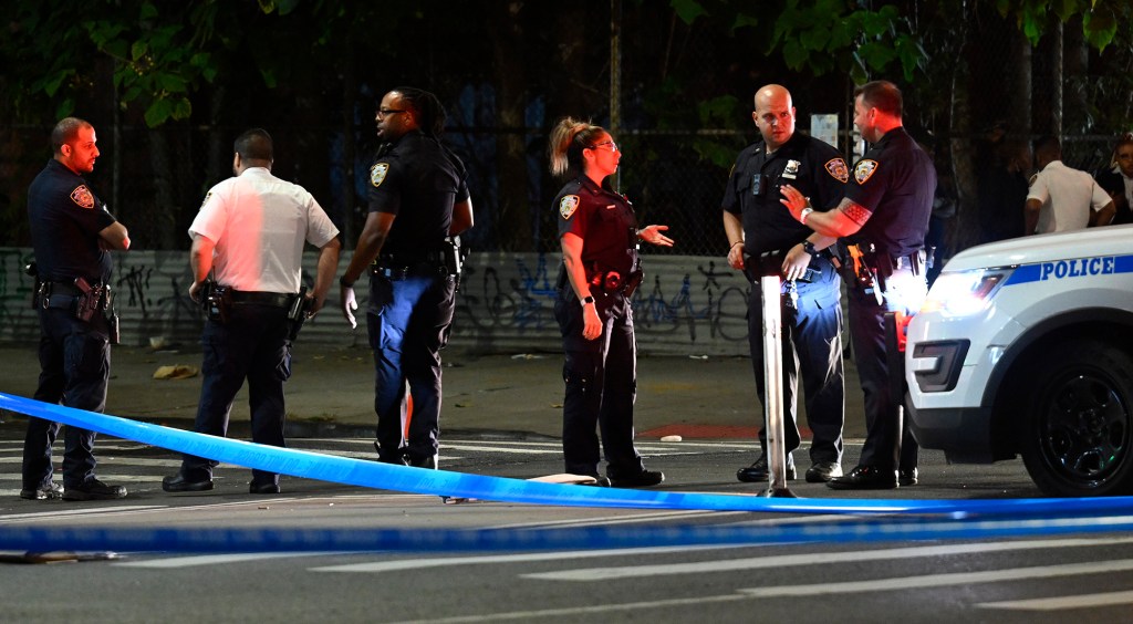 Cops investigate at the scene where a man was stabbed to death outside the 4th Ave. Tobacco Road Corp near President Street in Gowanus.