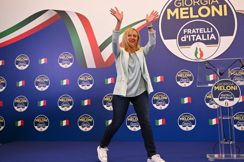 Giorgia Meloni acknowledges the audience after she delivered an address at her party's campaign headquarters overnight on September 26, 2022 in Rome after winning the National Election. 