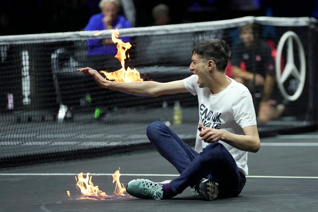 A protester sets himself on fire at the Laver Cup in London.