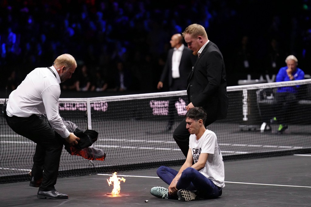 A protester sets himself on fire at the Laver Cup in London.