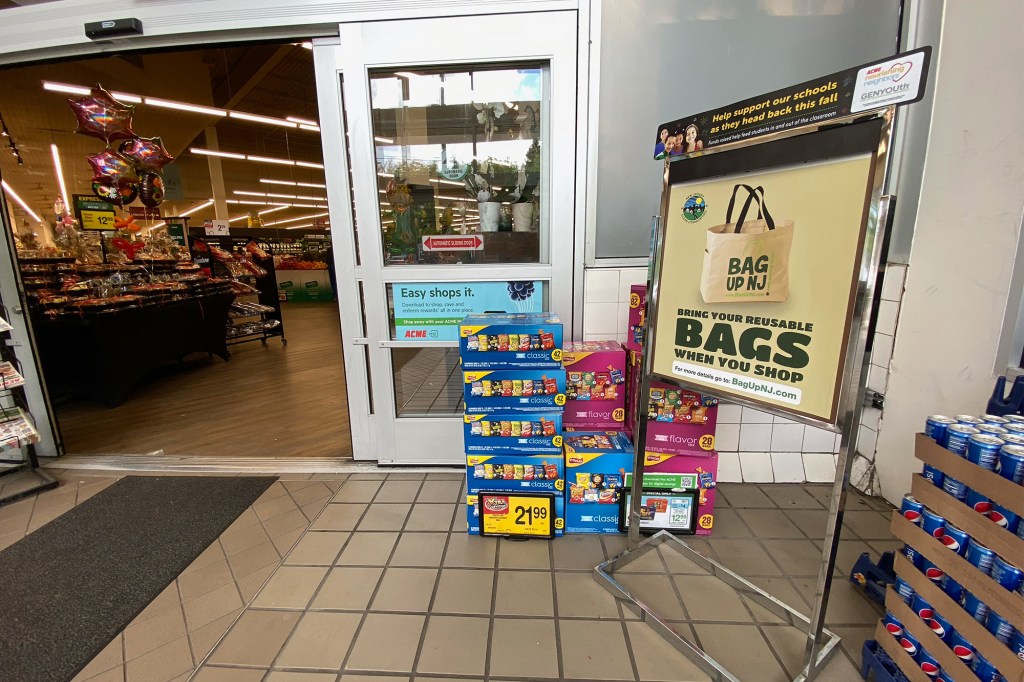 A sign advertising reusable bags for sale at a Fort Lee, New Jersey store.