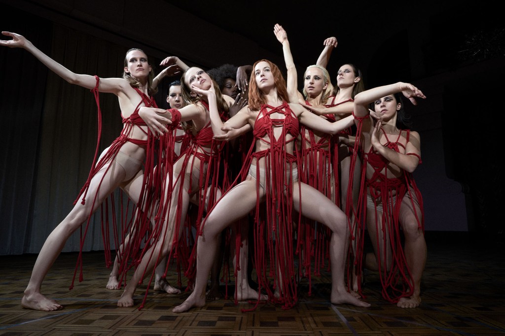 SUSPIRIA, Mia Goth (third from left), Alek Wek (center left), Dakota Johnson (center), Olivia Ancona (center right), 2018. 