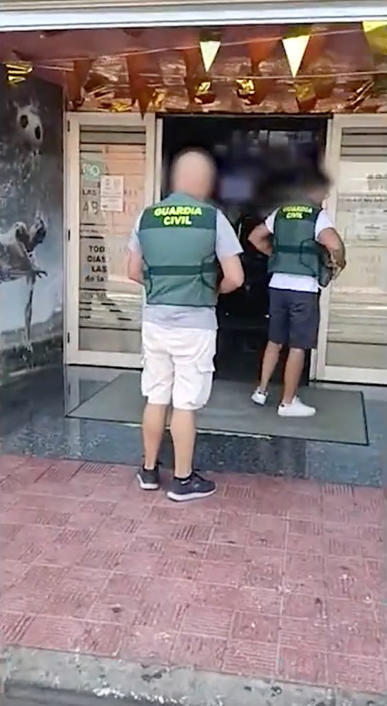 Civil Guard officers seen outside the casino before the arrest.