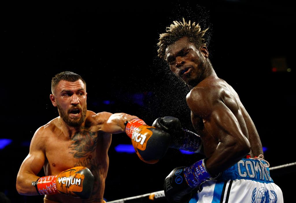 Vasiliy Lomachenko punches Richard Commey during his most-recent bout.