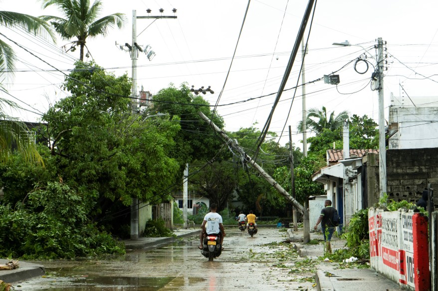 A fallen utility pole is spotted after the deadly Hurricane Julia carried strong winds and heavy rains in San Andres Island, Colombia.