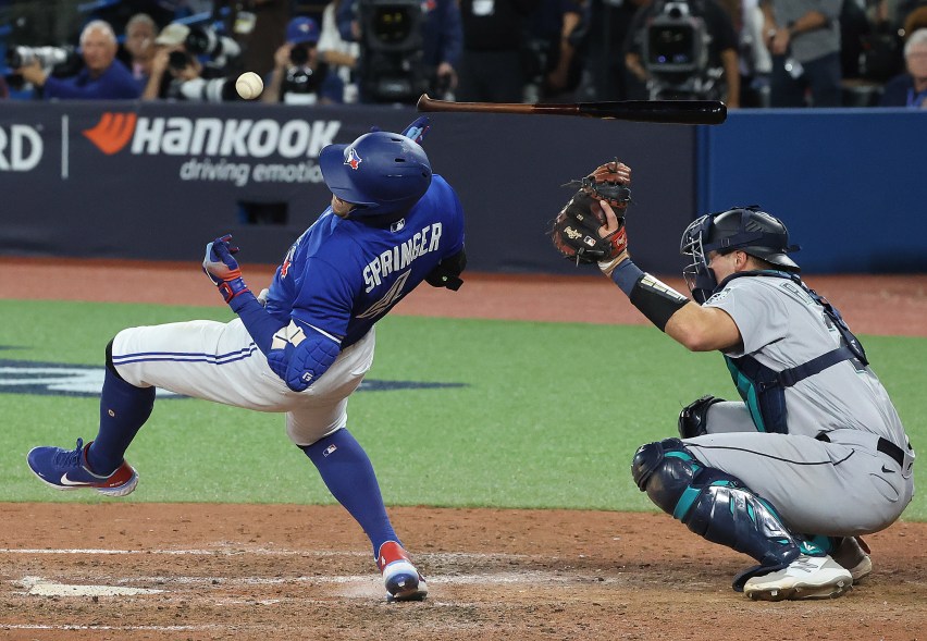 Toronto Blue Jays center fielder George Springer (4) is hit by a pitch by Luis Castillo in the eighth inning as the Toronto Blue Jays fall to the Seattle Mariners 4-0 in game one of their American League Wild Card series at Rogers Centre in Toronto. October 7, 2022.