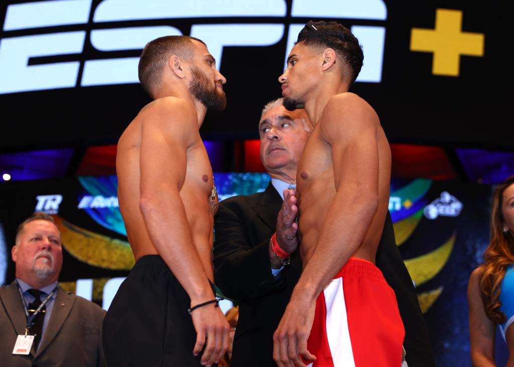 Vasiliy Lomachenko, left, and Jamaine Ortiz square off ahead of their bout.