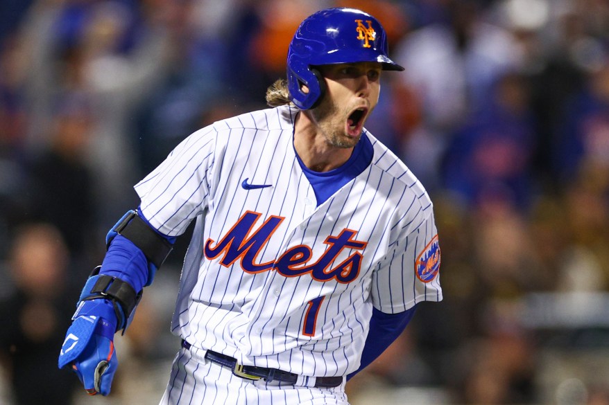 Jeff McNeil celebrates after hitting a 2-run double in the Mets' 7-3 win over San Diego on Oct. 8, 2022.