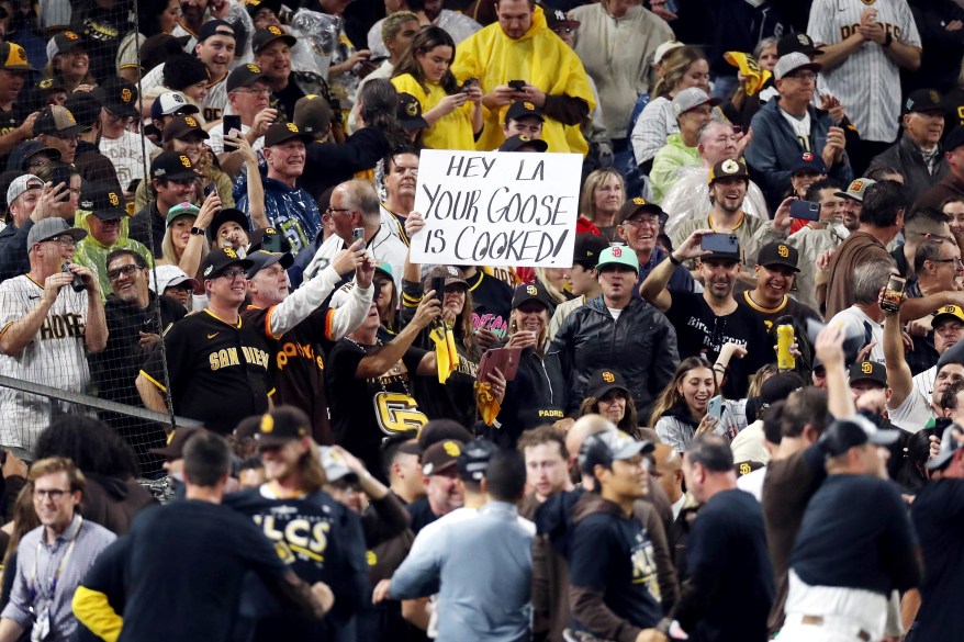 Padres players and fans celebrate after defeating the Dodgers in Game 4 of the NLDS on Oct. 15, 2022.