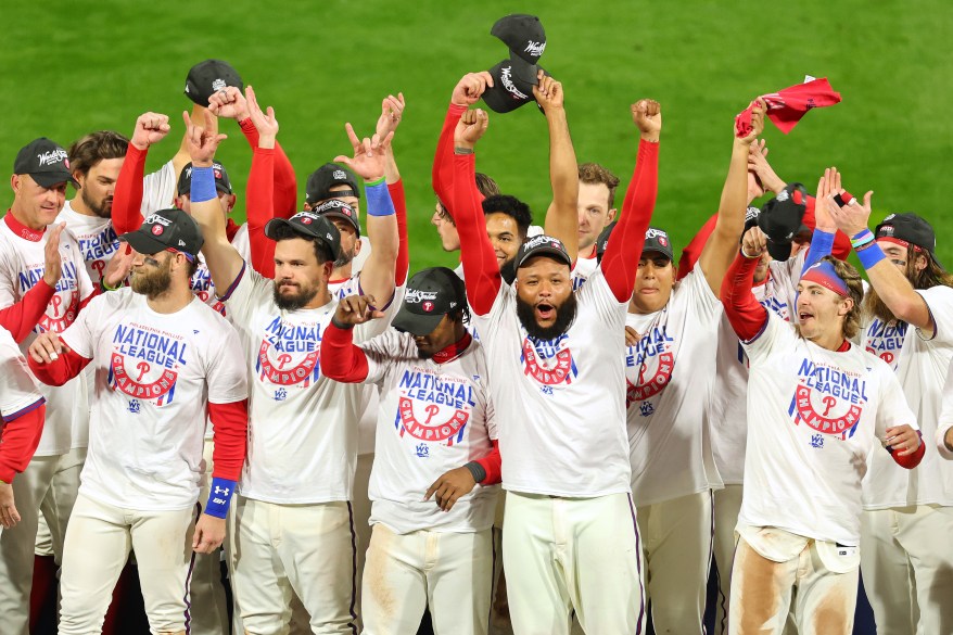 Members of the Philadelphia Phillies celebrate after defeating the San Diego Padres in game five to win the NL Championship on Oct. 23, 2022 in Philadelphia.