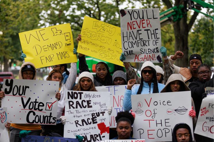 People protesting outside of the Capitol building as the Supreme Court hears the case of Milligan v. Merrill on October 4, 2022.