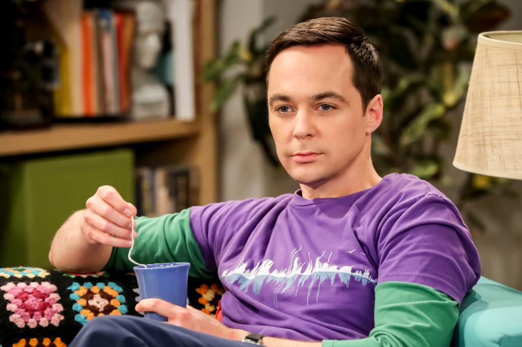 Jim Parsons as Sheldon sitting on a couch in "The Big Bang Theory."